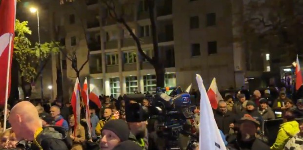 Riot police stand guard outside Poland’s Constitutional Tribunal in Warsaw as protesters gather at the gates.
